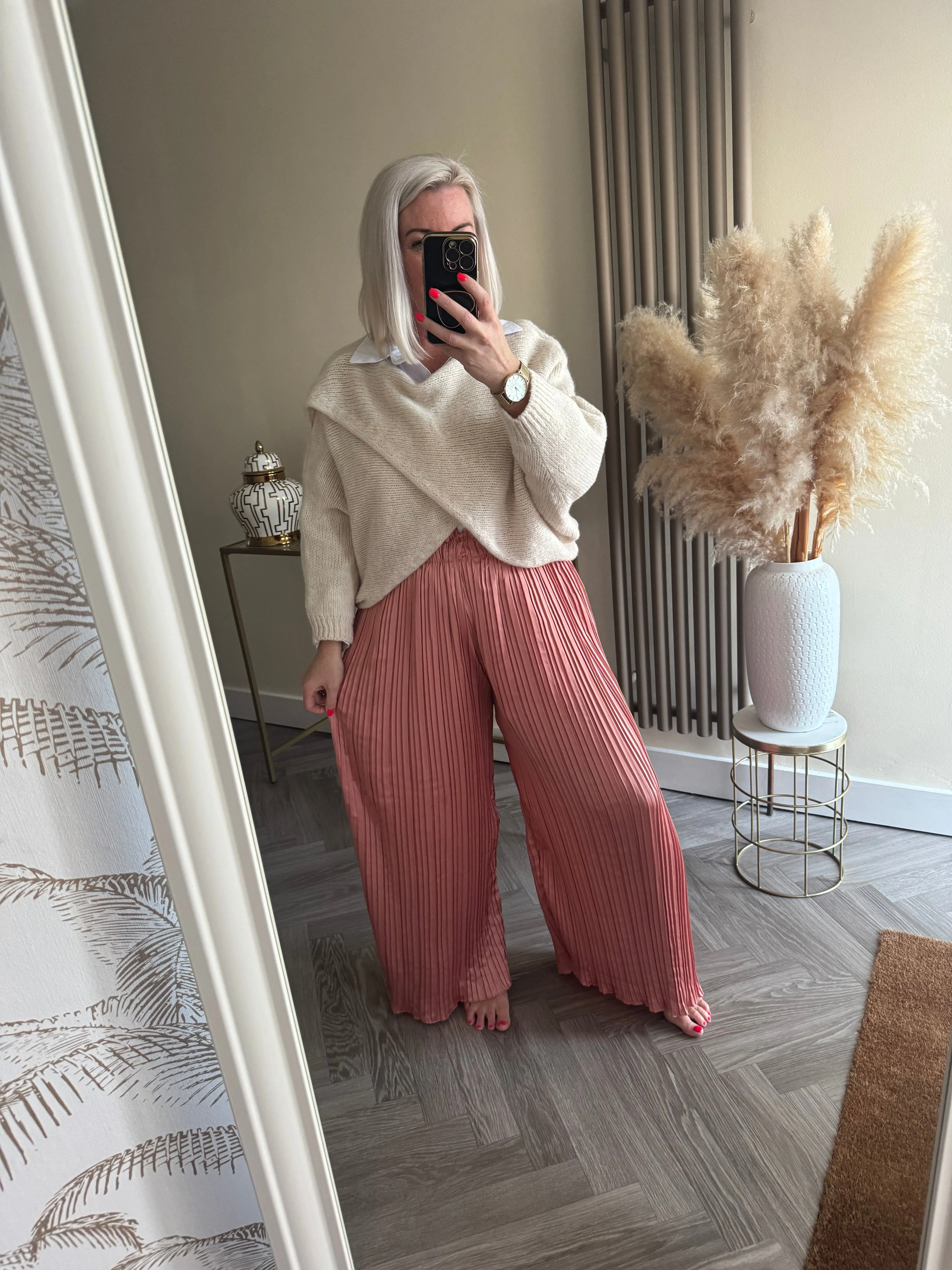 The satin pleated trousers