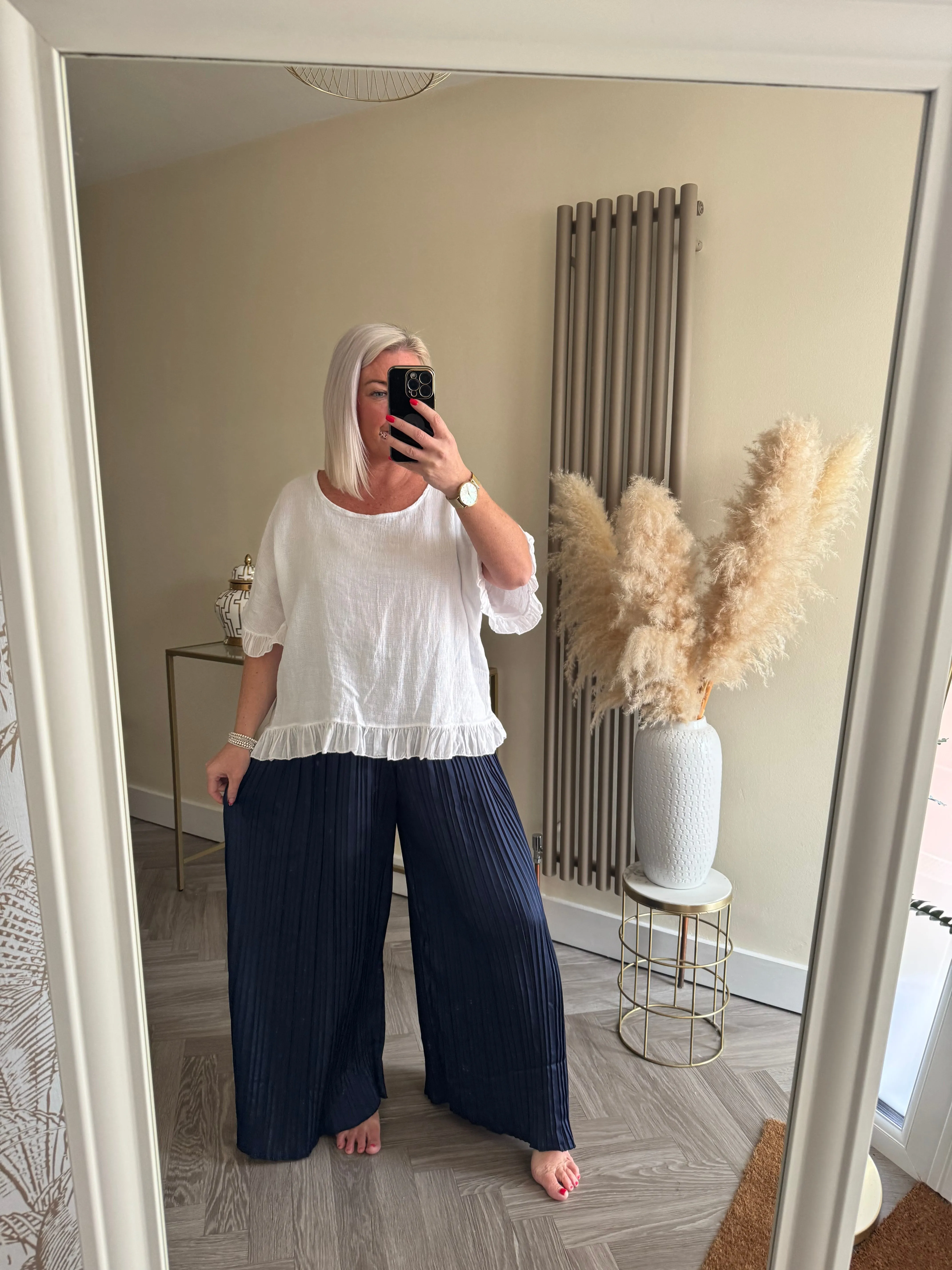 The satin pleated trousers