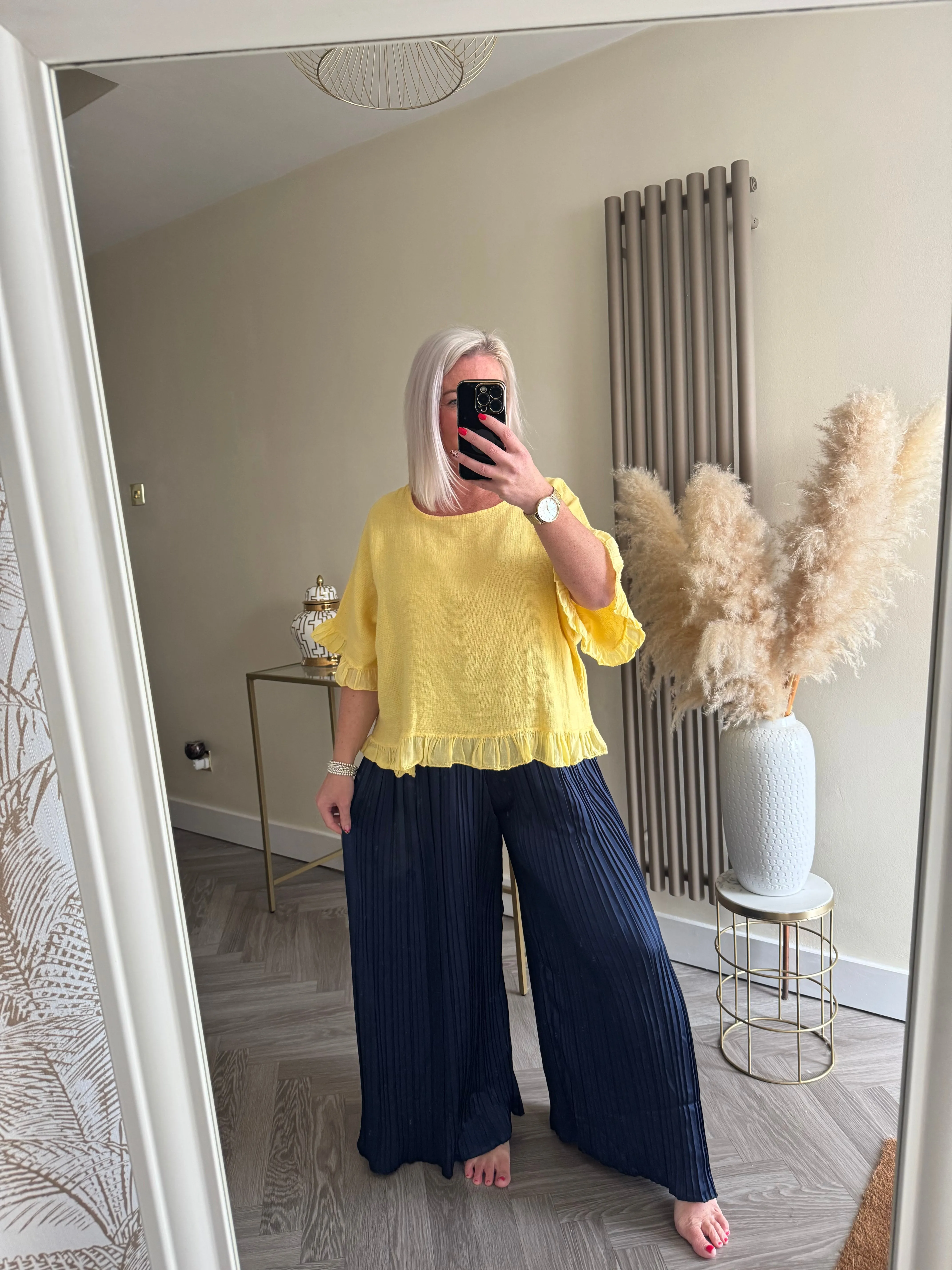 The satin pleated trousers