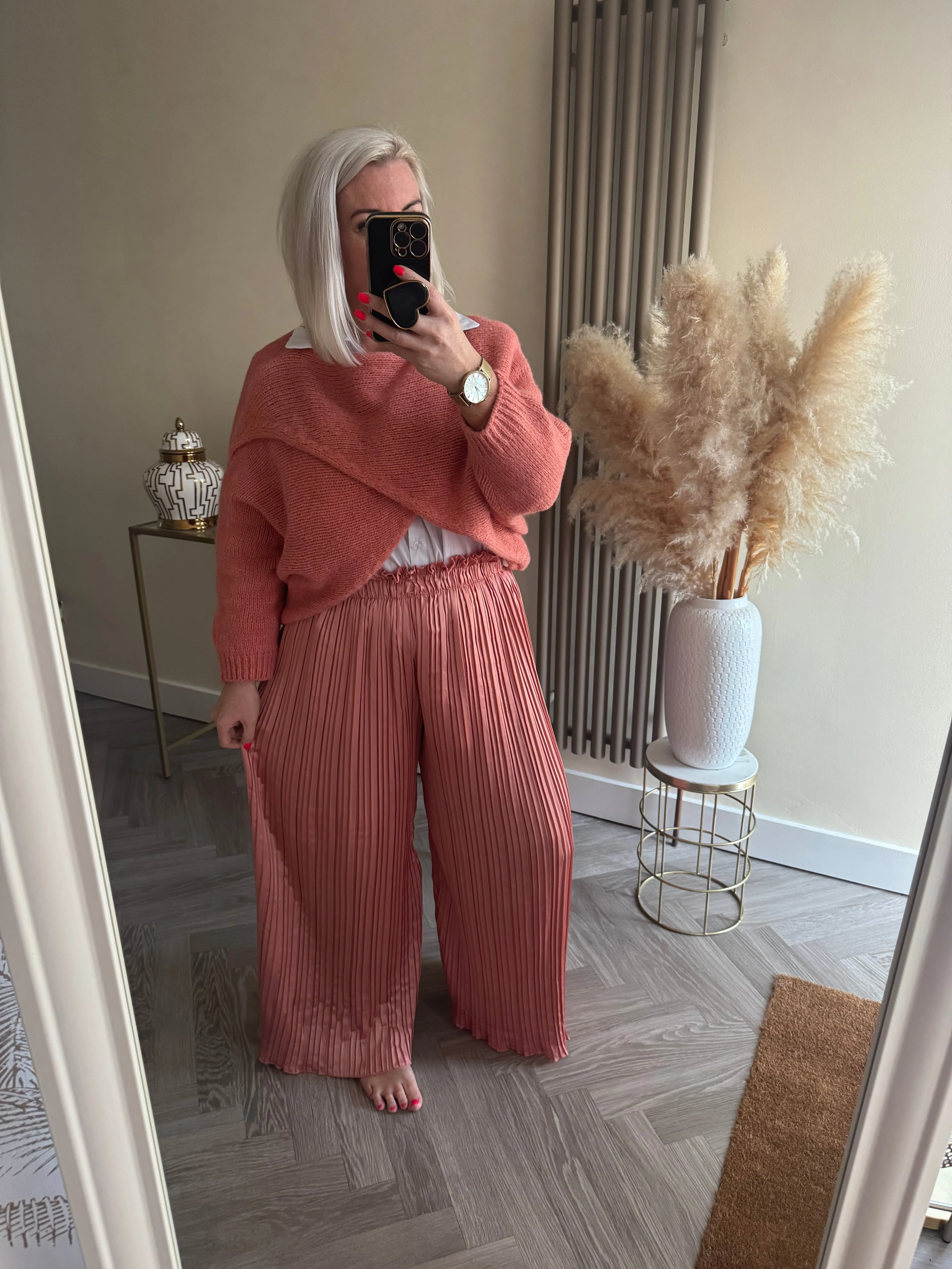 The satin pleated trousers